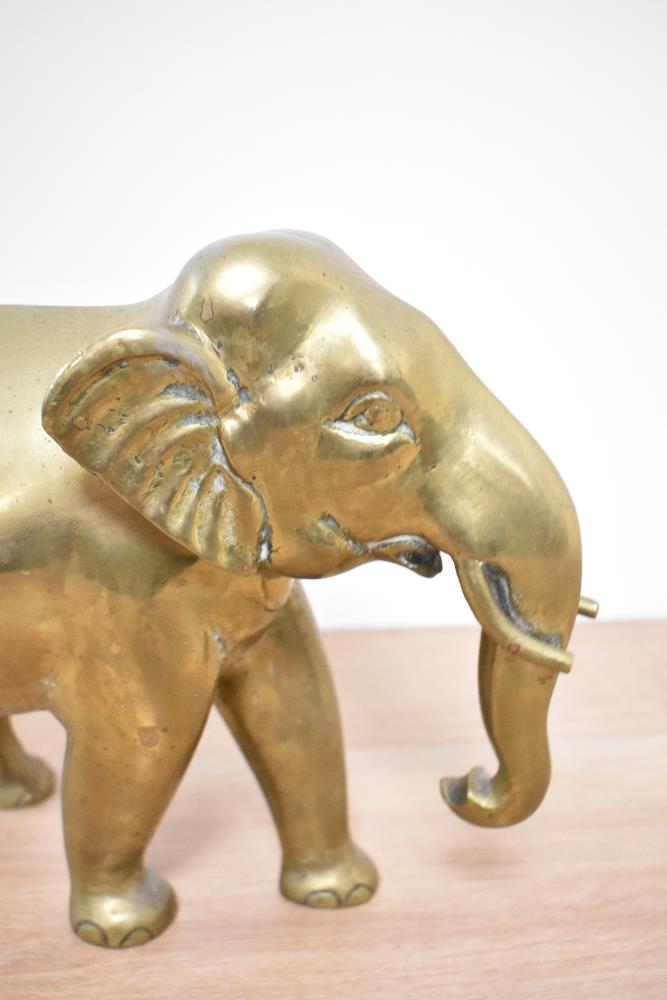 A vintage brass elephant, approx 21cm high by 30cm long. - Image 3 of 3