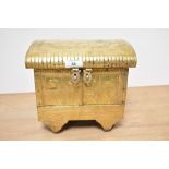 A vintage Indian jewellery box in the form of a vardo, with impressed animals to brass, over