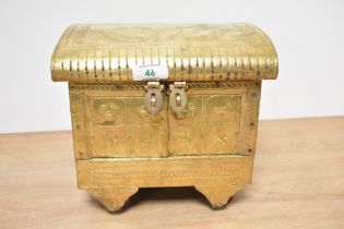 A vintage Indian jewellery box in the form of a vardo, with impressed animals to brass, over