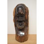 An African carved hardwood bust, depicting gent with beard.
