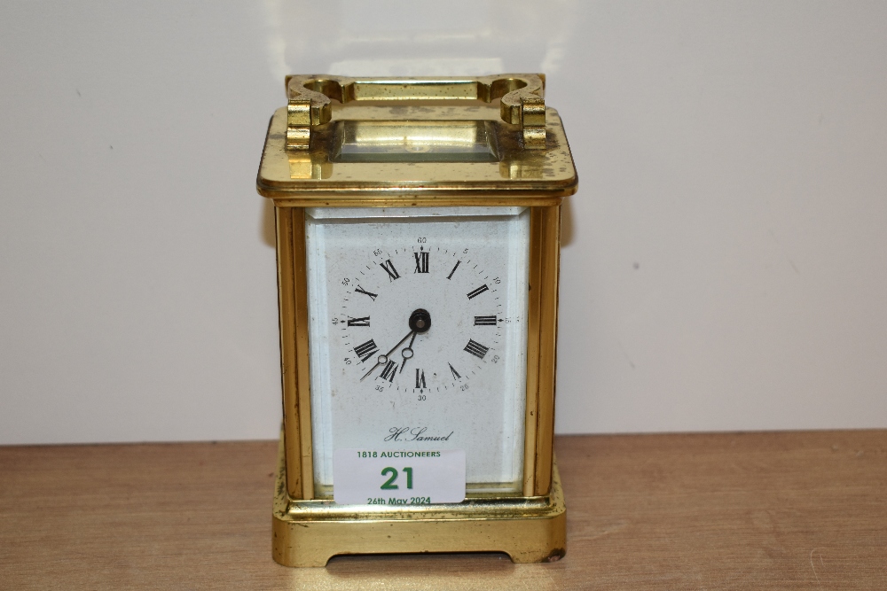 An English made Fema eleven jewel carriage clock, having bevelled glass panels and gallery, brass