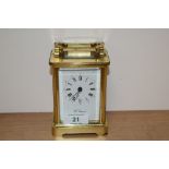 An English made Fema eleven jewel carriage clock, having bevelled glass panels and gallery, brass