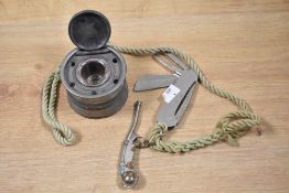 A Victorian pewter inkwell of cylindrical form with glass liner, measuring 6cm high, and a Barlow'