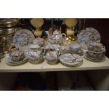 A selection of Japanese tea cups, saucers, tea pot, sugar basin and plates, having traditional