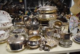 An assortment of plated ware, including coffee pot, marked 'The Windermere Can' with wicker bound