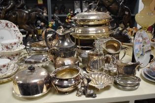 An assortment of plated ware, including coffee pot, marked 'The Windermere Can' with wicker bound