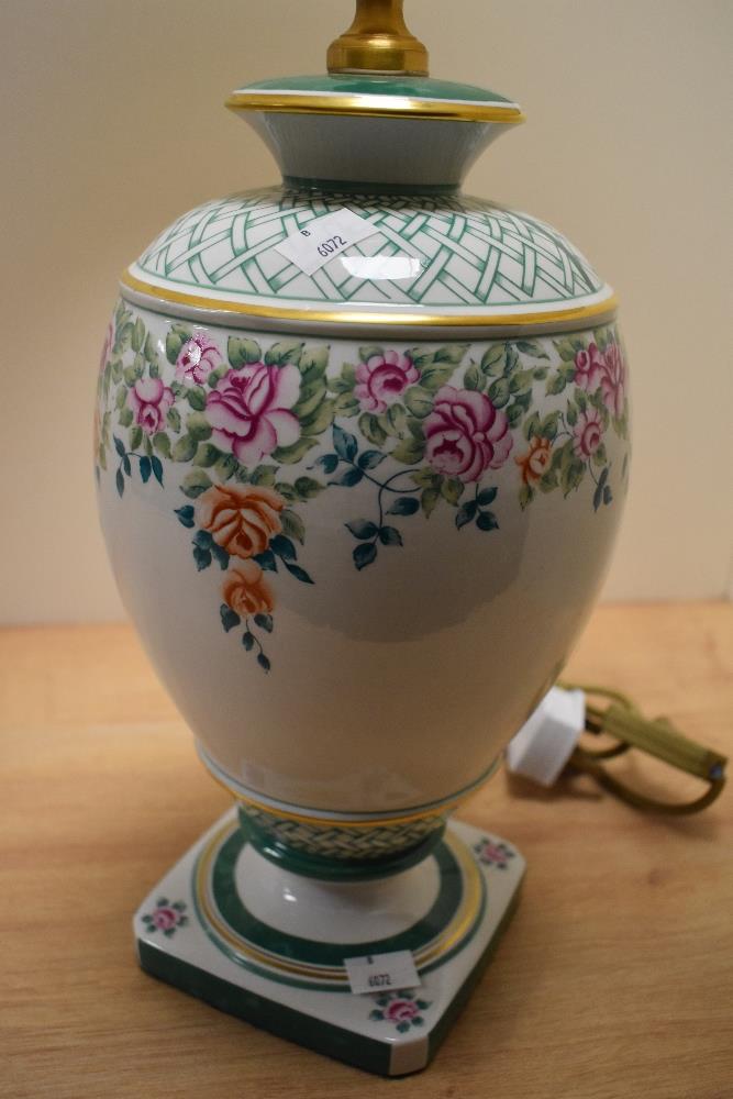 A 20th Century Italian porcelain table lamp, having a cream coloured shade, and floral decorated - Image 2 of 2