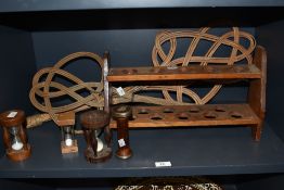 A mixed lot of treen egg timers, a shelf and two carpet beaters.
