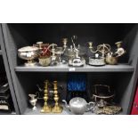 An assorted collection of silver plate and metalware, to include candelabras, cruet stands, candle