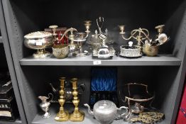An assorted collection of silver plate and metalware, to include candelabras, cruet stands, candle
