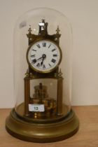 A late 19th / early 20th century brass anniversary clock, by Gustav Becker, having enamelled Roman