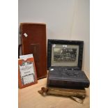 Two Victorian leather bound photograph albums, a framed early 20th Century school photograph, an