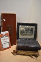 Two Victorian leather bound photograph albums, a framed early 20th Century school photograph, an