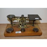 A set of 19th Century mahogany and brass postal scales, S.Mordan & Co., with weights, measuring 25cm