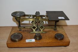 A set of 19th Century mahogany and brass postal scales, S.Mordan & Co., with weights, measuring 25cm