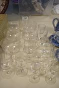 A collection of antique glasses, including etched and wine glasses and tumbler with etched logo; '