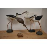 Four modern wooden wading birds, including oyster catcher and bittern.