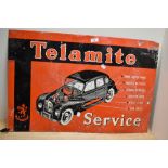 A vintage Telamite Service tin advertising sign painted in red, white, and black, measuring 49cm x