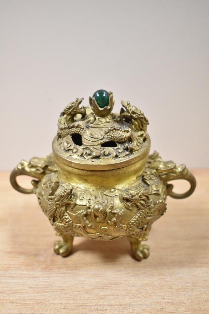 A 19th/20th Century Chinese cast metal lidded incense burner, the lid with polished green stone