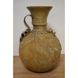 A studio pottery vase, having rustic finish, of bulbous form with handle to side, approx 36cm high.