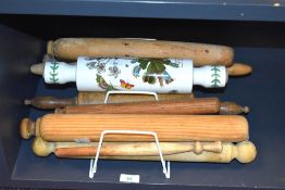 A collection of vintage wooden rolling pins and a Portmeirion botanicals rolling pin.