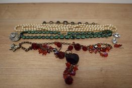 A selection of costume jewellery, including beads and brooches.