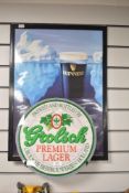 Two plastic advertising signs for Grolsch lager and Guinness, the largest measures 45cm x 65cm