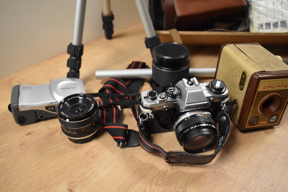 An assorted collection of cameras and equipment including a vintage Olympus camera, tripods, and - Image 2 of 2
