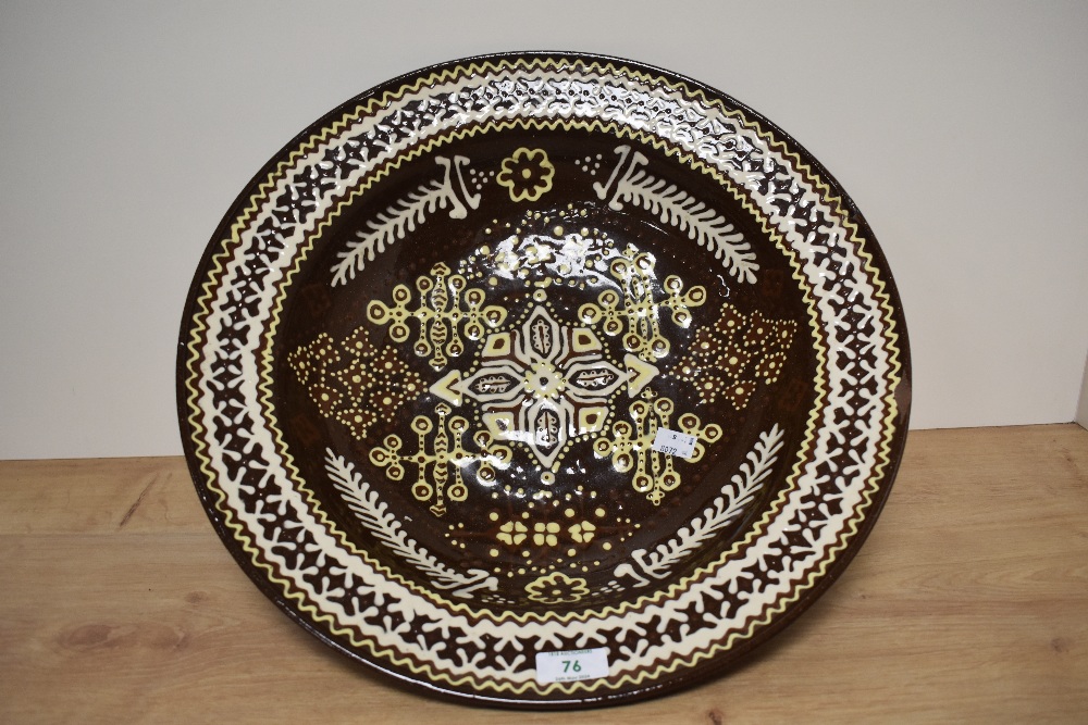 A large 20th century bowl, having white, yellow and brown glaze, approx 42cm across. Af chip to
