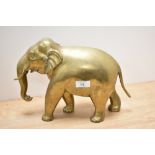 A vintage brass elephant, approx 21cm high by 30cm long.