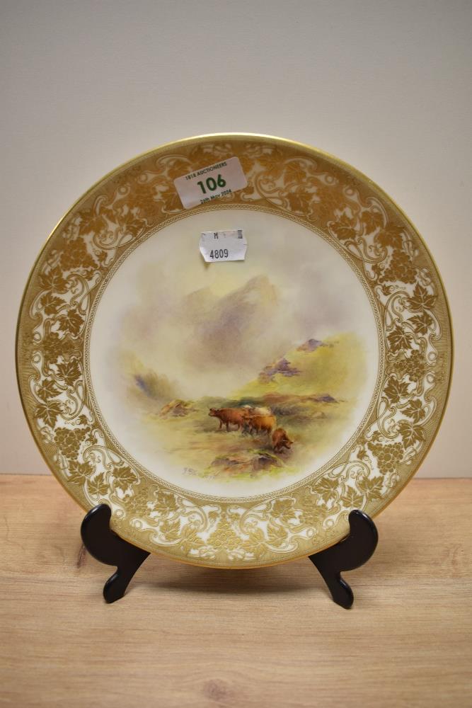 A hand painted Royal Worcester plate, circa 1916, having Highland cattle and mountain scene depicted