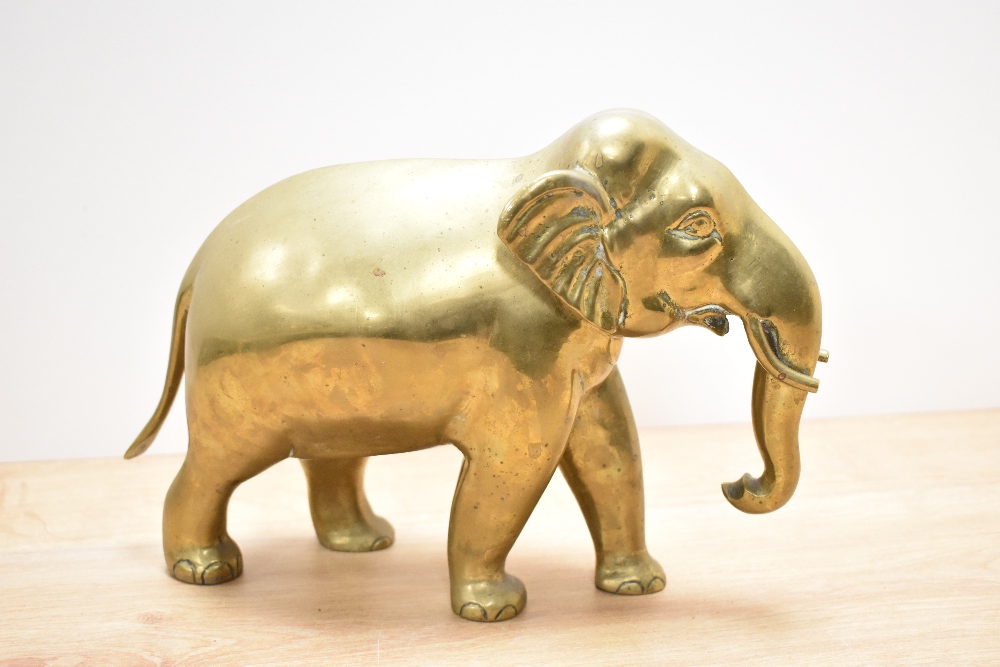 A vintage brass elephant, approx 21cm high by 30cm long. - Image 2 of 3