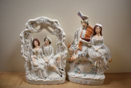 Two Victorian Staffordshire flat back ornaments, one depicting a Scottish couple sitting on a faux