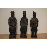 Three modern Chinese warrior figurines.