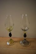 Two 20th Century decorative nosing glasses, having swirl design to the knopped stems and footed