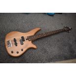 A Yamaha RBX270 bass guitar, having natural finish, serial number HY15056, with JHS vinyl gig bag