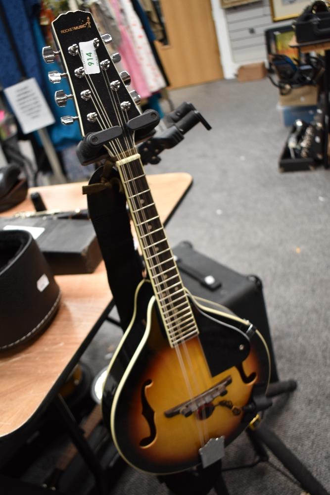 A modern mandolin, Rocket music , with later added pickup and soft stag case