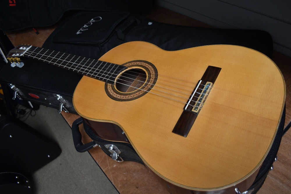 A classical guitar, labelled for Luthiers Tyrell & Preston, Wyre River Guitars, with hard case