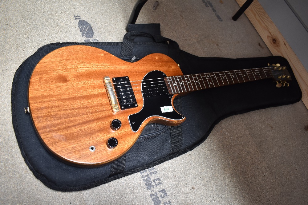 A Gordon Smith GS1 electric guitar having mahogany finish, sold with Fender padded gig bag