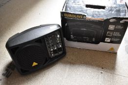 A Behringer Eurolive 150 Watt compact monitor system, with box, powers up and sound through each