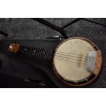 A traditional banjolele with case