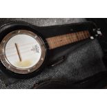 A traditional banjolele with case