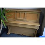 A vintage 20th Century golden oak cased upright piano, labelled for Strohmenger (Chapell) , serial