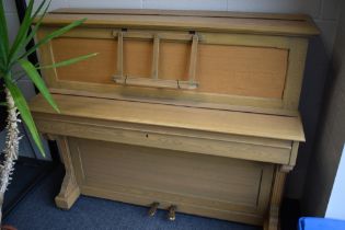 A vintage 20th Century golden oak cased upright piano, labelled for Strohmenger (Chapell) , serial