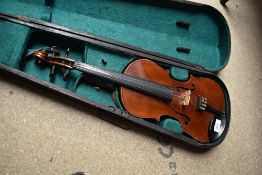 A traditional violin having 13 inch two piece back, with hard case, with printed label J G
