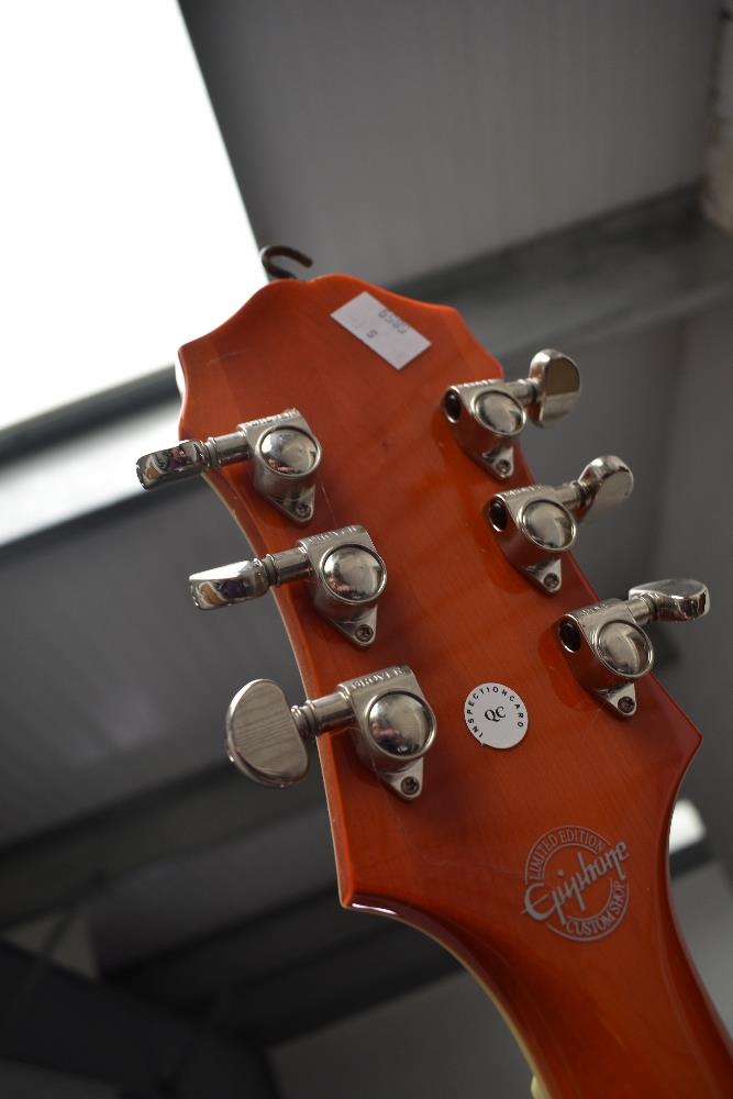 An Epiphone Swingster hollow body electric guitar with Bigsby , in orange finish, serial number - Image 3 of 3