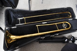 A King Trombone in fitted case, a Denis Wick mute and a K & M trombone stand