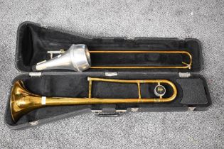 A King Trombone in fitted case, a Denis Wick mute and a K & M trombone stand