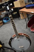 A modern 4 string banjo, Ozark with padded gig bag
