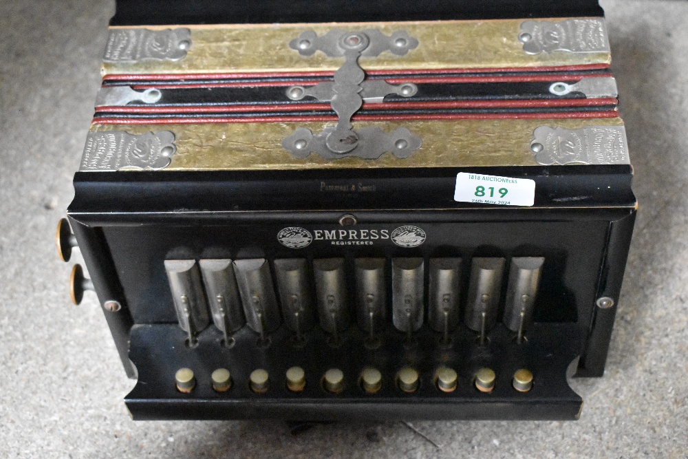 A vintage melodeon, marked Empress, Pammont & Smith